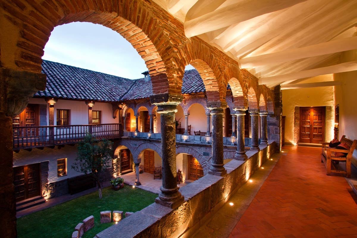 Brick arches over the courtyard at Inkaterra La Casona in Cusco