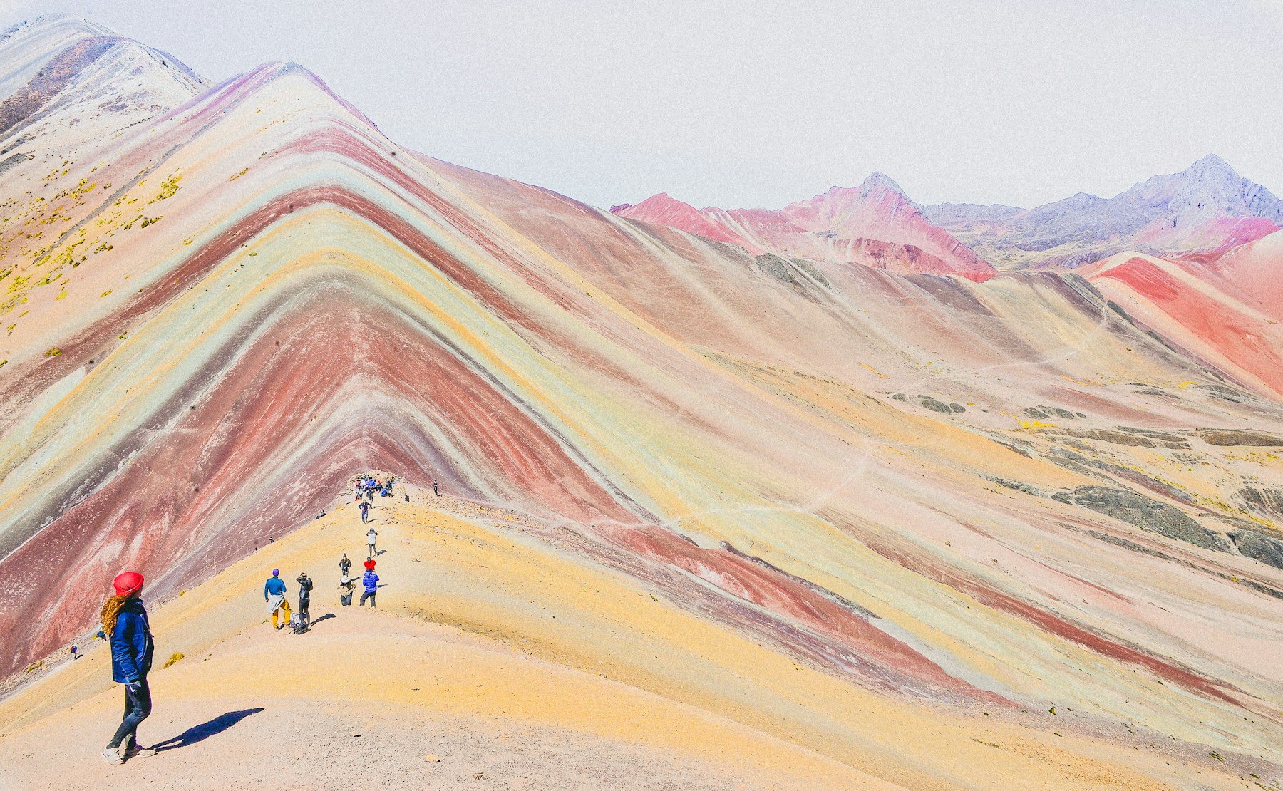 Mineral bands of red, gold and turquoise on Vinicunca