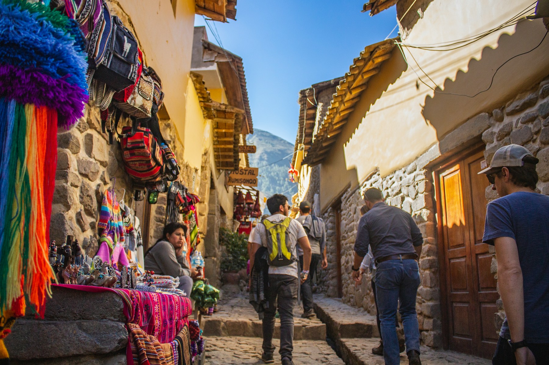 A guide walking a Cusco street with travelers